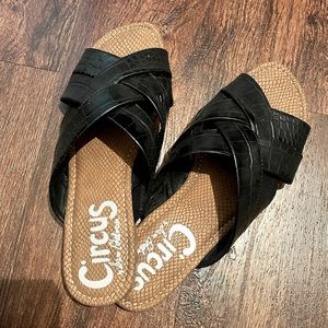 Black Sam Edelman leather slide sandals.